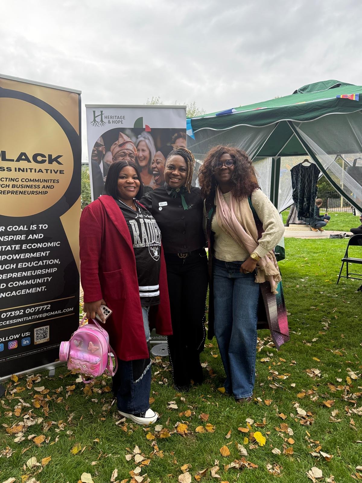 Heritage & Hope community members representing the organisation at an outdoor community event